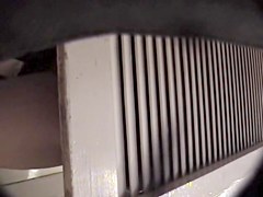 Man with cam trying to see something in change room