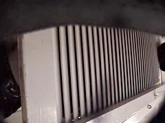 Man with cam trying to see something in change room