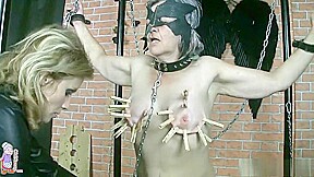 Mature mistress ties up her slave and uses clothespins to torture her