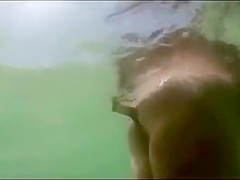My busty girlfriend sticks a beer bottle in her vagina and swims around
