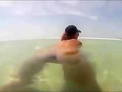 My busty girlfriend sticks a beer bottle in her vagina and swims around