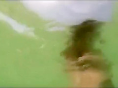 My busty girlfriend sticks a beer bottle in her vagina and swims around
