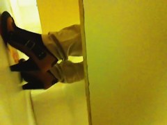 Nothing but legs in heeled shoes on toilet pissing movie