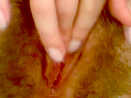 Pale girl mastubates her hairy pussy