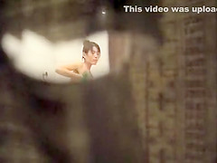 Peeping on her nude body through a hole