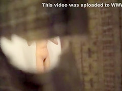 Peeping on her nude body through a hole