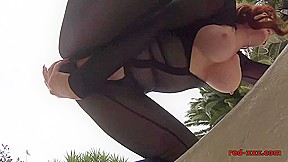 Red fucks a big black dildo in the backyard
