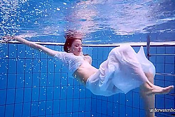 Redhead Marketa In A White Dress In The Pool
