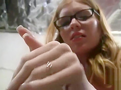 Redhead in glasses jerks a guy off
