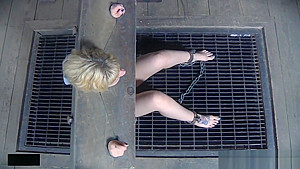 Restrained slave slapping with another sub
