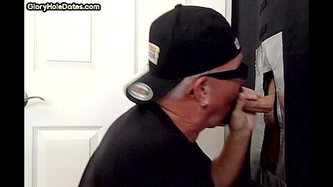Senior gloryhole amateur gay blows BFs dick through hole