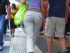 Sexy brunette with nice tits, a nicer ass on a sidewalk candid vid