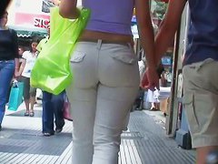 Sexy brunette with nice tits, a nicer ass on a sidewalk candid vid