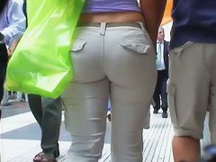 Sexy brunette with nice tits, a nicer ass on a sidewalk candid vid