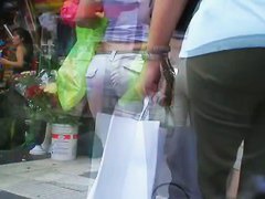 Sexy brunette with nice tits, a nicer ass on a sidewalk candid vid