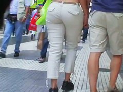 Sexy brunette with nice tits, a nicer ass on a sidewalk candid vid