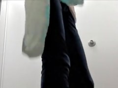Skinny sweetheart trying on tight jeans in change room