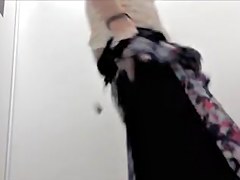 Skinny sweetheart trying on tight jeans in change room