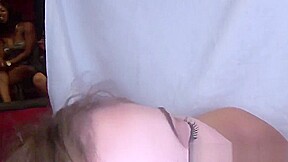 Slutty redhead sucks black stripper on camera
