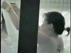 Smiling and talking Asian dolls showering hot bodies