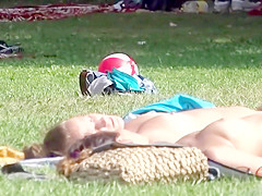 Stunning young piece of ass gets filmed while sunbathing to