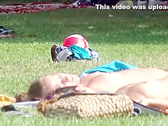 Stunning young piece of ass gets filmed while sunbathing to