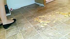 Suzi walks over unpeeled bananas, on floor, wearing her black ballet flats
