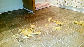 Suzi walks over unpeeled bananas, on floor, wearing her black ballet flats