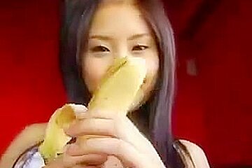 Titless Asian teen 18+ plays with a banana