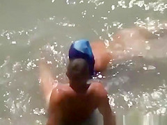 Woman blows her man's cock in the water