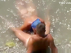Woman blows her man's cock in the water