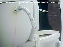 Woman takes a piss in toilet