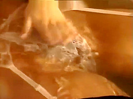 Woman takes bath fully Clothed