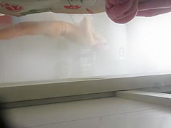 Woman undressing to wash her tight body