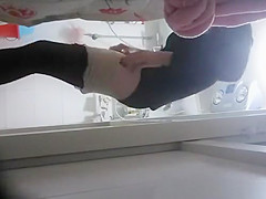 Woman undressing to wash her tight body