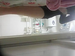 Woman undressing to wash her tight body