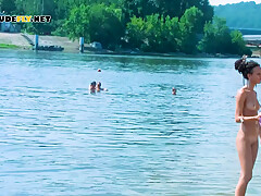 Young nudists is tantalizing and making the girls around her jealous
