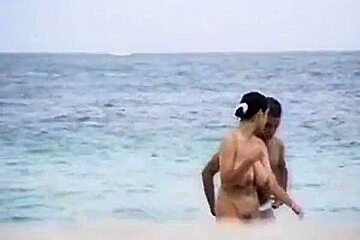 shy girl with big tits on French beach