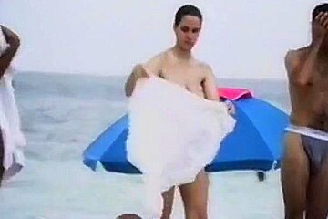 shy girl with big tits on French beach