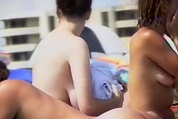shy girl with big tits on French beach